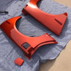 Daytona Sunset Orange Metallic rear fender quarter panels for a c6 corvette