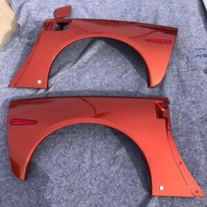 Daytona Sunset Orange Metallic rear fender quarter panels for a c6 corvette