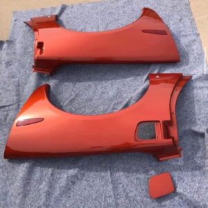 Daytona Sunset Orange Metallic rear fender quarter panels for a c6 corvette