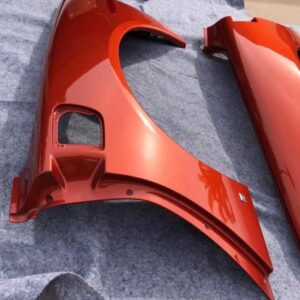 Daytona Sunset Orange Metallic rear fender quarter panels for a c6 corvette