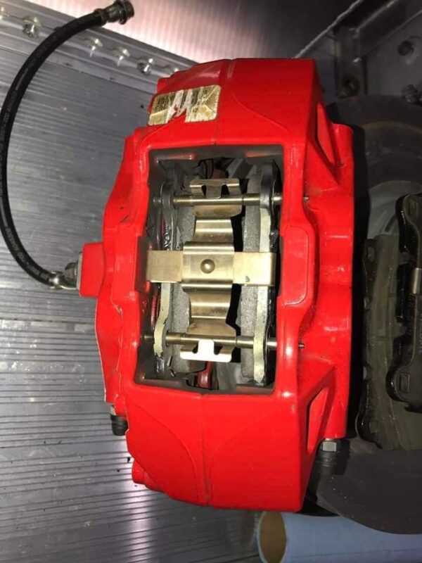 All 4 of the OEM Brembo Red Brake Calipers, with Stock Brake lines, Stock Rotors and Pads with 4100 miles on them - Image 3